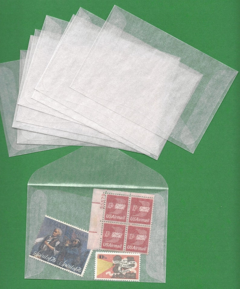 May include: A stack of ten clear plastic envelopes with a red, white, and blue US Airmail stamp and a Spirit of '76 stamp inside one of the envelopes.