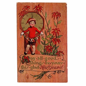 May include: Vintage New Year's postcard featuring a child in a red outfit and hat, holding a garland. The background includes a clock, red flowers, and text that reads "May all good things be yours this glad New Year!"