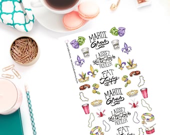 May include: A set of Mardi Gras themed stickers featuring a variety of colorful designs, including masks, beads, crowns, and the phrases "Mardi Gras", "Fat Tuesday", and "Laissez Les Bon Temps Rouler".