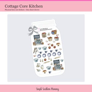 May include: A mason jar-shaped sticker sheet featuring various kitchen-themed illustrations including blue cabinets, wooden ladders, bowls, teacups, plates, apples, rolling pins, and baskets. A grey ribbon is attached to the top left corner.