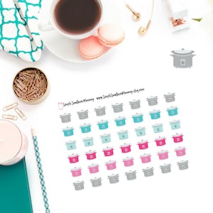 May include: A sheet of stickers featuring various colored slow cooker icons. The stickers are in shades of gray, teal, pink, and light blue. The text "Simple Southern Mommy" and a website address are printed at the top of the sheet.