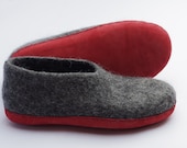 Felt wool slippers with sole for women or man made from natural dark gray sheep wool