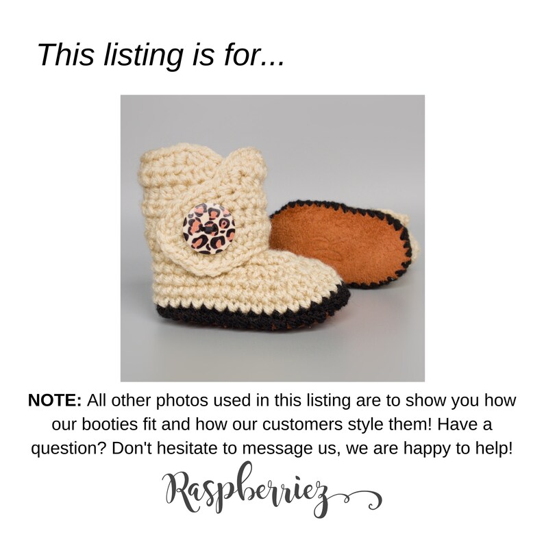 May include: A pair of cream-colored crocheted baby booties with black trim and a brown suede sole. The booties have a leopard print button on the front.
