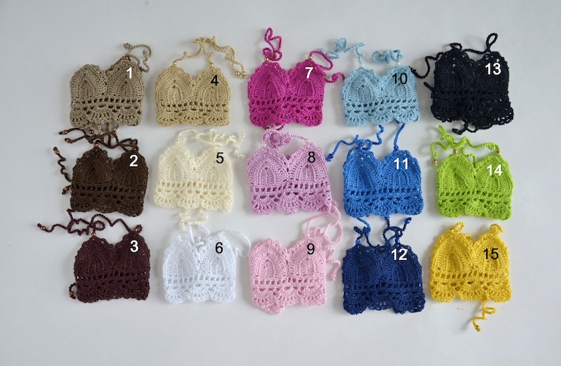 May include: A collection of fifteen handmade crochet halter tops in various colors, including brown, beige, pink, blue, and black. Each top features a unique design and is displayed on a white background. The tops are numbered 1 through 15.