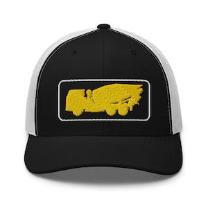 May include: A black and white trucker hat with a yellow embroidered image of a cement mixer truck.