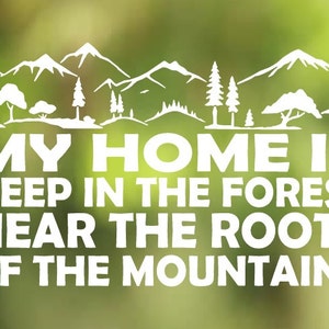 May include: White text on a green background reads "My home is deep in the forest near the roots of the mountains".  The text is surrounded by a silhouette of mountains, trees, and a forest.