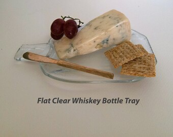 Recycled melted clear whiskey bottles, upcycled bottle serving trays, glass serving spoon rests, recycled glass tableware, barware.