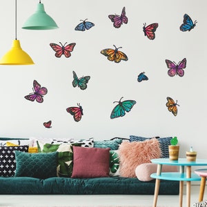 May include: A white wall with a variety of colorful butterfly wall decals. The butterflies are in different sizes and positions, creating a whimsical and decorative effect.