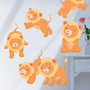 May include: Six orange lion cub wall decals with smiling faces. The lion cubs are in various poses, including standing, sitting, and walking.