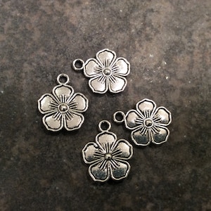 Tropical flower charms in Silver finish with double sided detail package of 4 charms for jewelry making