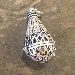 Diffuser locket with Antique Silver finish and rhinestone detail Essential Oil diffuser opens and closes Filigree Diffuser locket