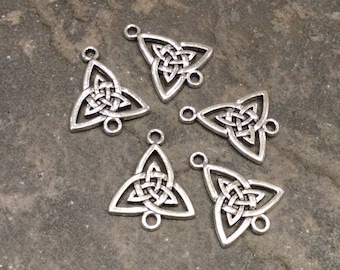 May include: Six silver-toned triangular charms with a Celtic knot design. Each charm has two jump rings for attaching to jewelry or other crafts.