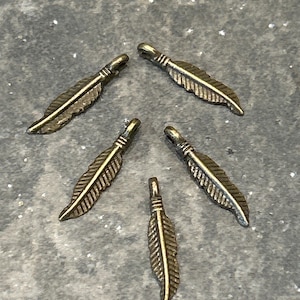 CLEARANCE Tiny Bronze Feather charms Package of 5 Feather charms with pendant bails