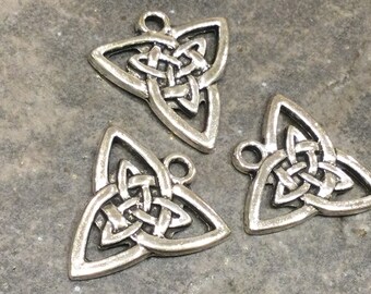 May include: Three silver triangular Celtic knot charms with a loop at the top for hanging.