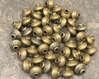Bronze finish Bali style silver bicone spacer beads Package of 10 beads Tibetan bronze patterned beads