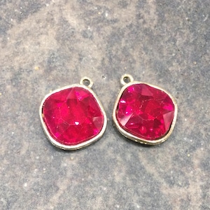 Ruby Red bezel set faceted glass charms Package of 2 gold finish charms