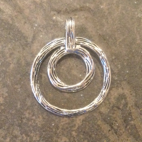 Circle pendant with textured silver finish and large hole bail One pendant