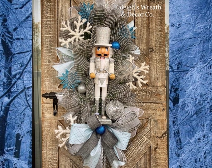 Featured listing image: Nutcracker Wreath for Front Door, Blue and Silver Christmas Decor, Christmas Door Wreath, Nutcracker Decorations, Winter Snowflake Wreaths