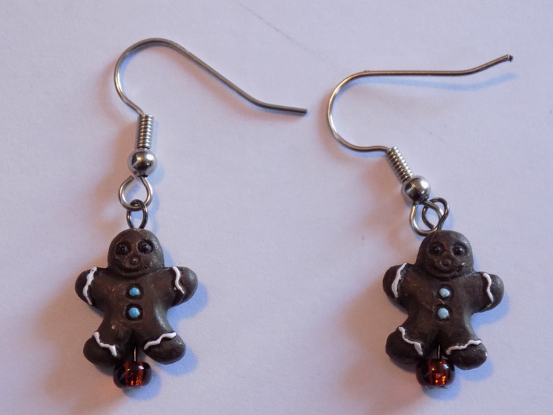 Gingerbread Earrings Gingerbread Man Gingerbread Woman Gingerbread Man & Woman Dark Gingerbread Man Gingerbread House 5 Styles Dk Gingerbread Man