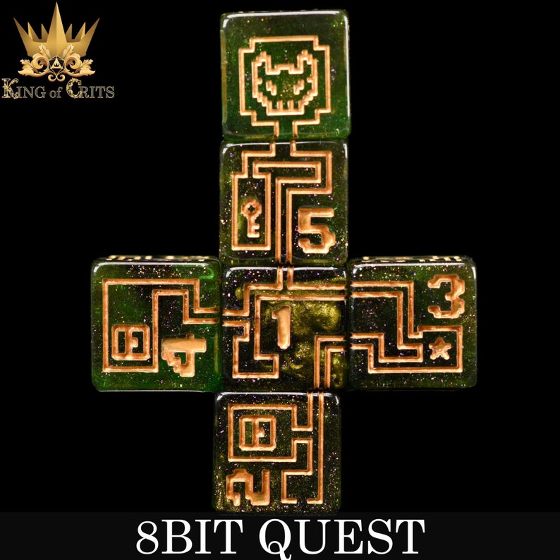 May include: A set of six green dice with gold glitter and gold-colored 8-bit inspired designs. The dice are arranged in a cross shape. The numbers 1, 2, 3, 4, 5, and a pixelated skull are visible. The dice are labeled "8BIT QUEST".