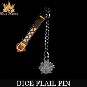 May include: A black metal dice flail pin with a chain and a red, yellow, and brown handle. The flail head is a black metal d20 with a white crown on it. The pin says "Dice Flail Pin" at the bottom.