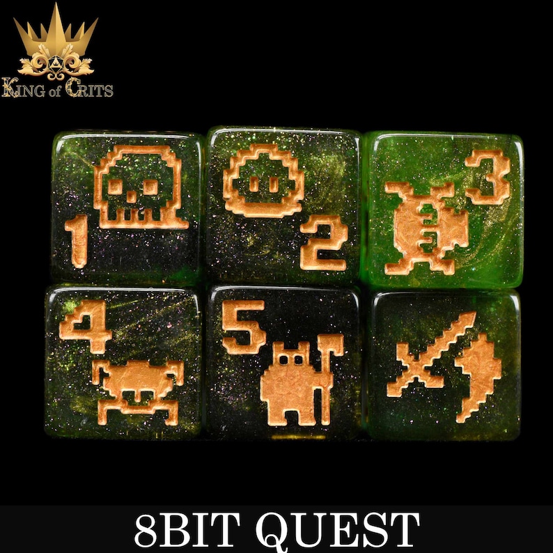 May include: Six green dice with gold glitter and gold pixelated images. The dice are numbered 1 through 6. The images include a skull, a spaceship, a bug, a crab, a robot, and a sword. The dice are labeled "8BIT QUEST".