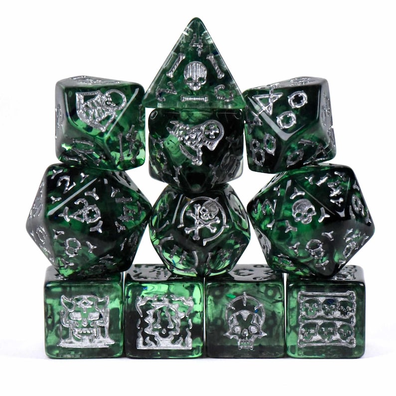 May include: A set of ten green and silver dice, featuring various shapes including a pyramid, cubes, and multi-sided dice. The dice have a dark green, marbled appearance with silver-colored symbols and skull designs. Ideal for tabletop gaming.