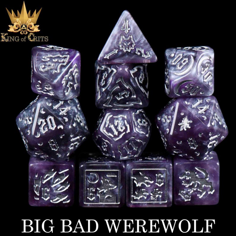 May include: A set of purple and white marbled dice with silver numbering and symbols. The dice are arranged on a black background, with the text "BIG BAD WEREWOLF" at the bottom. The top left corner has the text "KING of CRITS" with a crown logo.