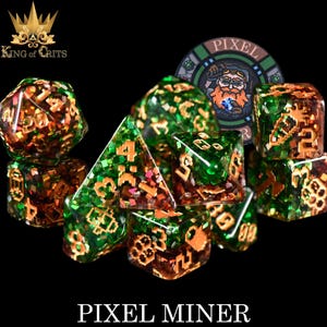 May include: A set of ten green and gold dice with a pixelated design. The dice are scattered on a black surface. The dice are labelled with numbers 1 through 6. The dice are part of a set called "Pixel Miner".