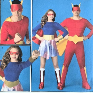 May include: Simplicity sewing pattern number 2565 for a superhero costume. The pattern includes instructions for making a red and yellow costume with a cape, a blue and yellow costume with a cape, and a red mask with yellow horns. The pattern is for sizes 8-18/XS-XL.