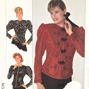 May include: Simplicity sewing pattern featuring a red jacket with black embroidery and a black skirt. The pattern includes multiple design options, size 10, and EUR 38. The package is white with the Simplicity logo and images of the finished garments.