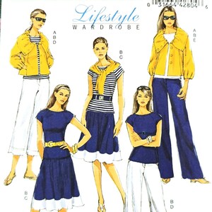 May include: A Butterick B5335 sewing pattern for a Lifestyle Wardrobe. The pattern features illustrations of various outfits, including a yellow jacket, striped top, and navy blue dress. The pattern size is BB (8-10-12-14).