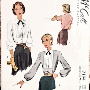 May include: A vintage McCall printed pattern envelope for a blouse, number 7194, size 14, bust 34. The cover features illustrations of three blouse variations with pleated fronts, collars, and bows, paired with skirts. The text reads Mrs. Albert Frank.