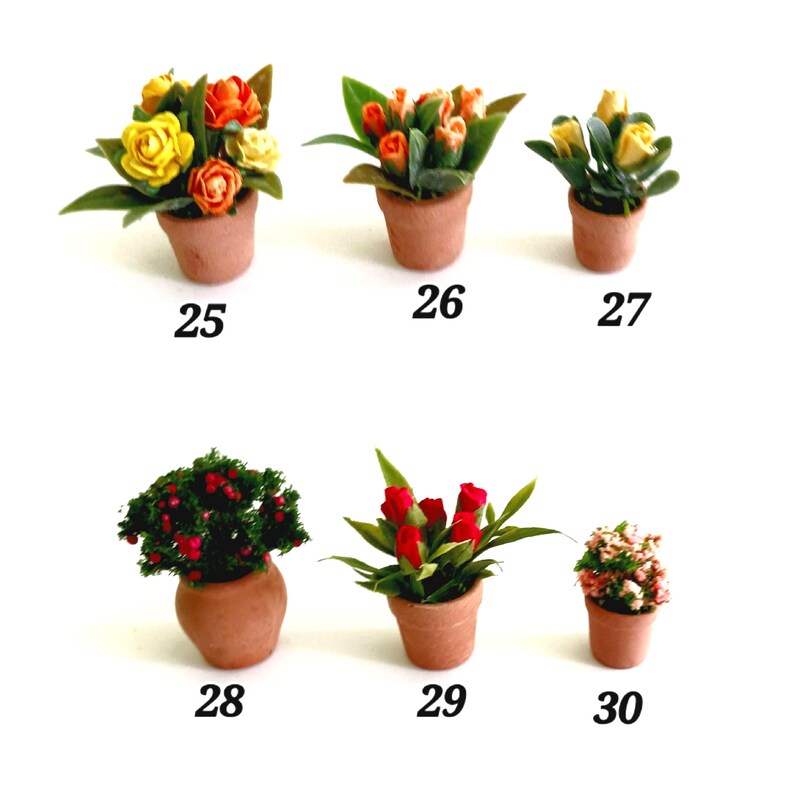 May include: Six miniature potted plants labeled 25 through 30. The collection includes terracotta-colored pots containing various artificial flowers and greenery, such as yellow and orange roses, red tulips, a berry bush, and small pink blossoms.