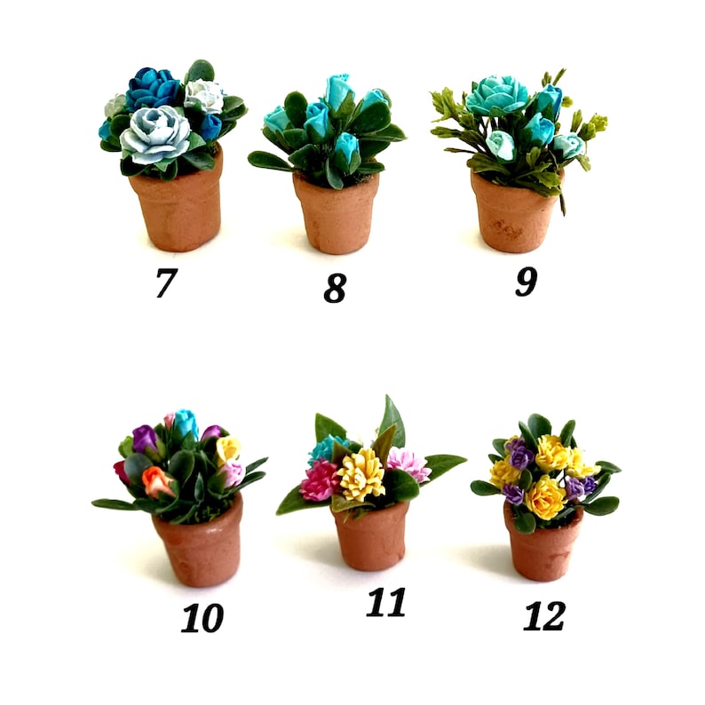 May include: Six miniature potted plants labeled 7 through 12. Each features a terracotta-colored clay pot containing small artificial flowers in various colors including blue, white, yellow, pink, and orange, surrounded by green leaves.
