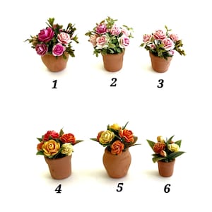May include: Six miniature potted flower arrangements in terracotta-colored clay pots, labeled 1 through 6. The top row features pink and white roses, while the bottom row displays yellow, orange, and red roses with green leaves.
