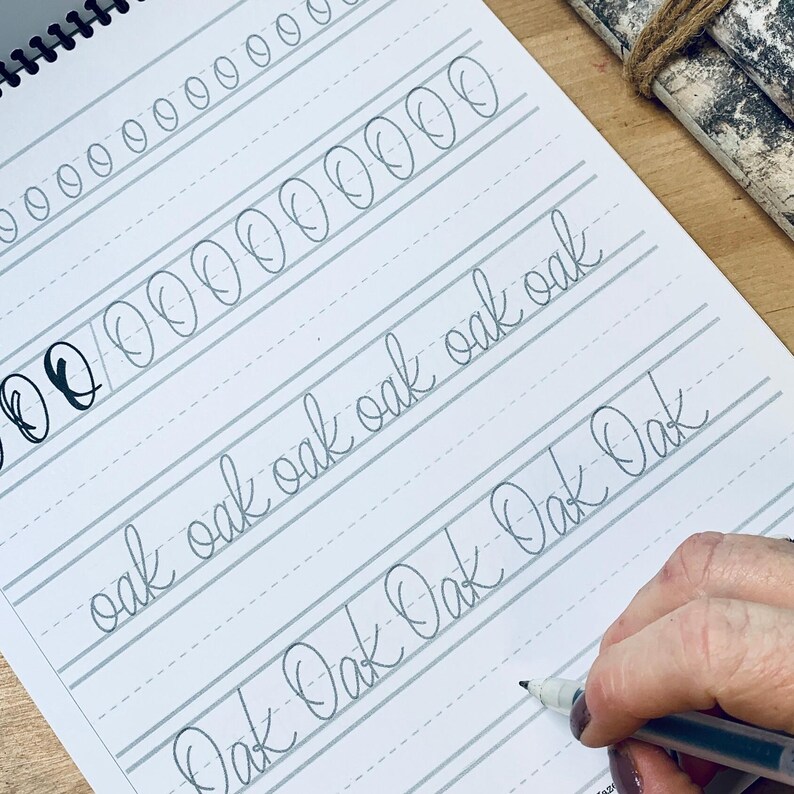 Make beautiful handwriting a part of your creative life with this lettering guide! It's perfect for beginners or intermediate creatives looking to learn lettering with a handwritten flair. Find this Etsy Bestseller at herhazeleyes.com