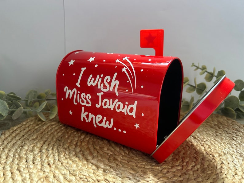 May include: Red metal mailbox with a white flag and the words "I wish Miss Javaid knew..." written on the front.