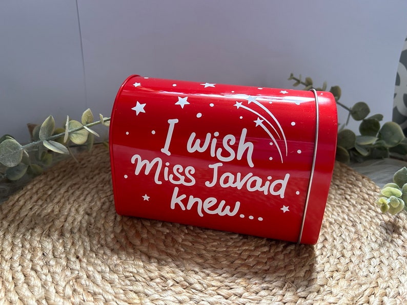 May include: Red metal mailbox with white stars and the text "I wish Miss Javaid knew..."