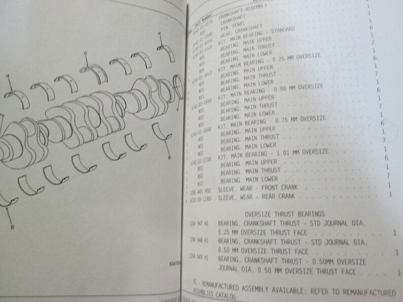 May include: A black and white line drawing of a crankshaft assembly with various parts labeled. The drawing shows the crankshaft, main bearings, and connecting rods. The image also includes a parts list with corresponding numbers for each part.