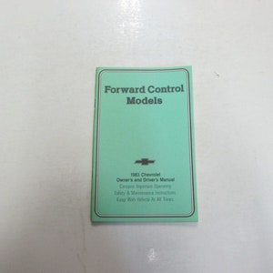 May include: A green booklet with the title "Forward Control Models" and the text "1983 Chevrolet Owner's and Driver's Manual Contains Important Operating Safety & Maintenance Instructions Keep With Vehicle At All Times".