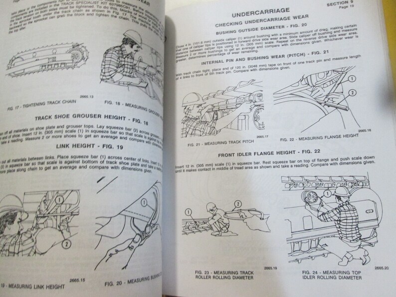 May include: A black and white illustrated guide for measuring different parts of a crawler tractor undercarriage. The guide includes illustrations and instructions for measuring track shoe grouser height, link height, track pitch, front idler flange height, top idler rolling diameter, and track roller rolling diameter.