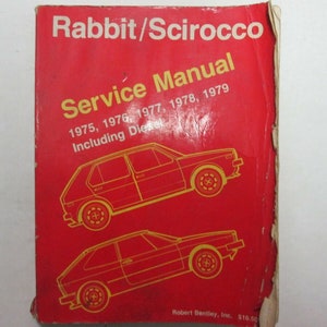 May include: A red cover of a service manual for the Volkswagen Rabbit and Scirocco cars. The manual covers models from 1975 to 1979, including diesel models. The cover features a line drawing of a Rabbit and a Scirocco.