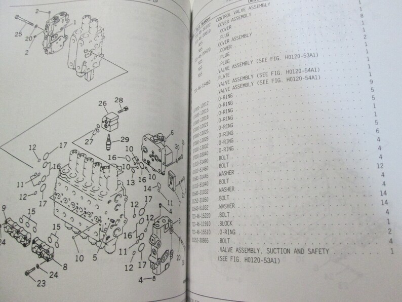 May include: A detailed diagram of a valve assembly, suction and safety, with numbered parts labeled. The diagram shows the internal components of the valve assembly, including the O-rings, bolts, washers, and block.