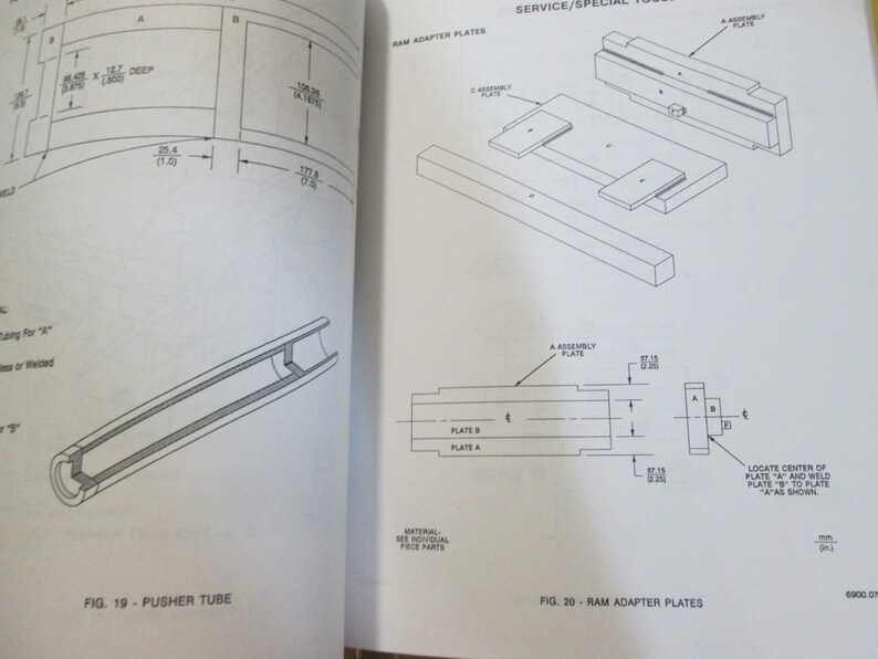 May include: A black and white line drawing of a ram adapter plate assembly. The drawing shows the different parts of the assembly, including the plate, the assembly plate, and the location of the center of the plate. The text "SERVICE/SPECIAL TOOLS" is visible at the top of the image.