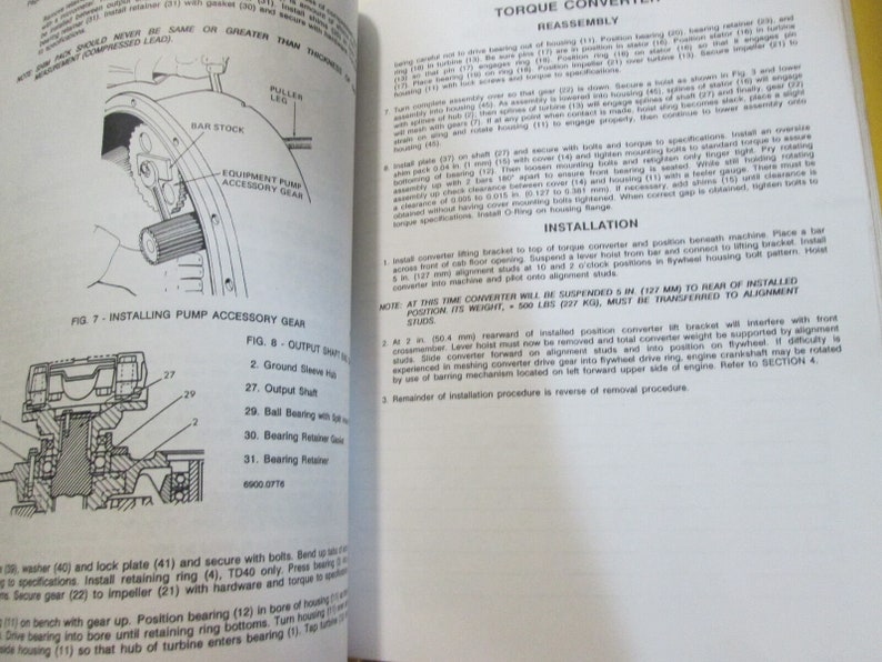 May include: A black and white technical illustration showing the steps for installing a pump accessory gear. The illustration includes labels for each part, such as "Output Shaft", "Ball Bearing", and "Bearing Retainer".