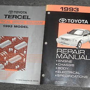 May include: Two repair manuals for a 1993 Toyota Tercel. The manuals are bound in blue and red covers with the Toyota logo and the model year. The left manual is titled "Electrical System" and the right manual is titled "Repair Manual" with sections for engine, chassis, body, electrical, and specifications.