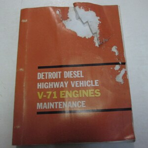 May include: An orange and black manual titled "Detroit Diesel Highway Vehicle V-71 Engines Maintenance".