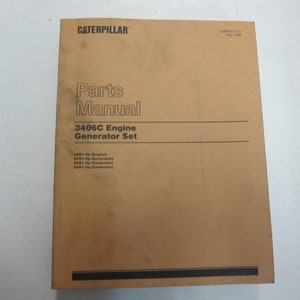 May include: A brown Caterpillar Parts Manual for the 3406C Engine Generator Set. The manual is dated May 1998.