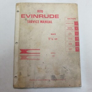 May include: A 1970 Evinrude Mate 1 1/2 HP outboard motor service manual. The cover is beige with red text and a red Evinrude logo. The manual includes sections for introduction, general service information, fuel system, ignition system, power head, lower unit, and more.